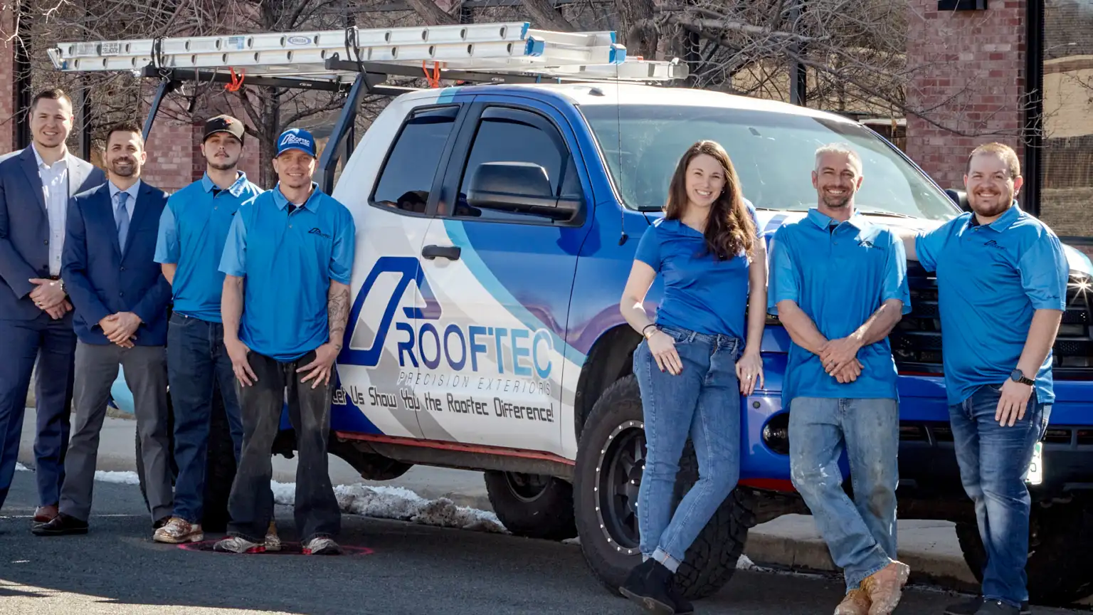 RoofTec Roofers Posing In Front Of RoofTec Truck Image of RoofTec Precision Exteriors roofers posing in front of truckr